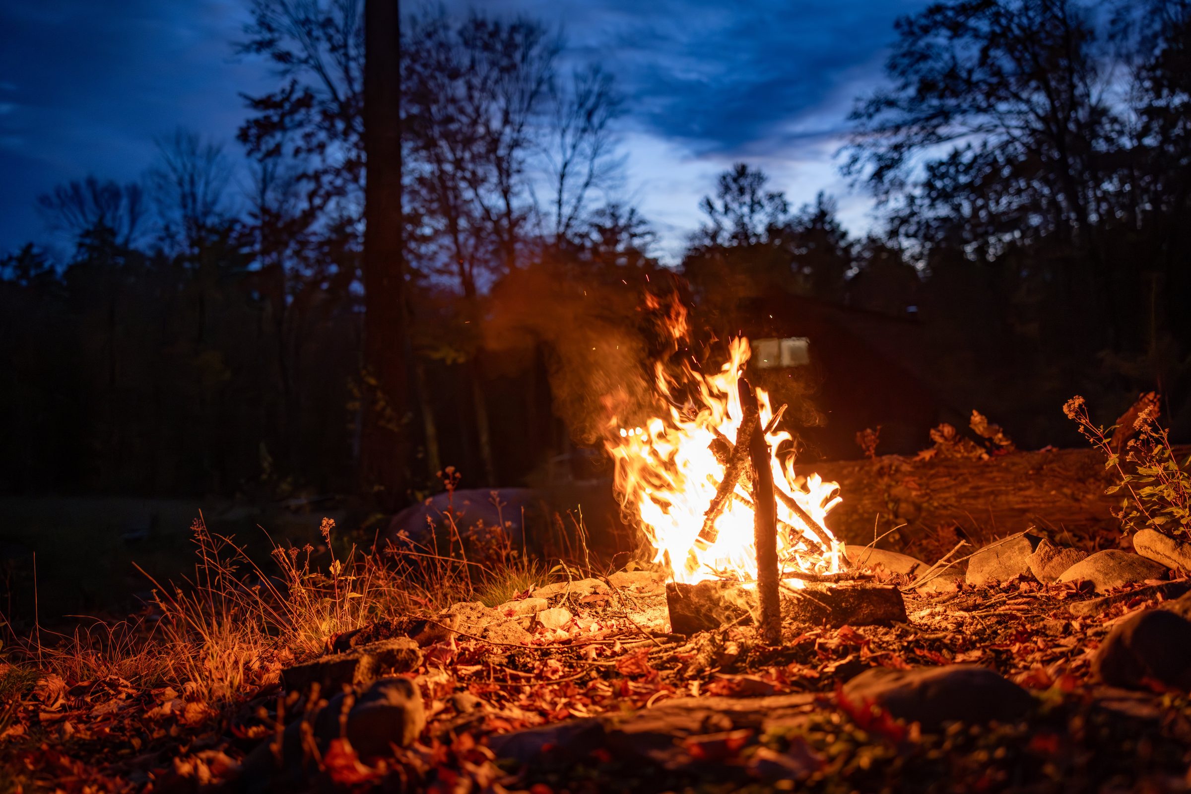 The firepit blazing at dusk
